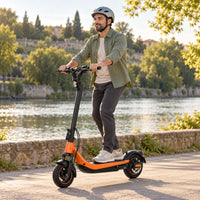 AI-generated illustration of an adult wearing a helmet riding the orange KingSong N15 on a paved riverside route